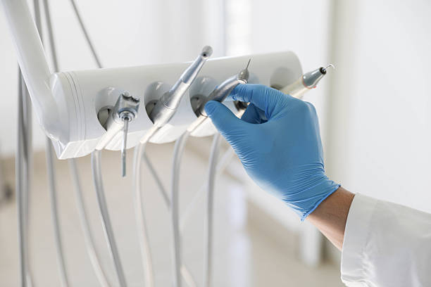 Professional Tooth Extraction technician working in Harrisburg, NC